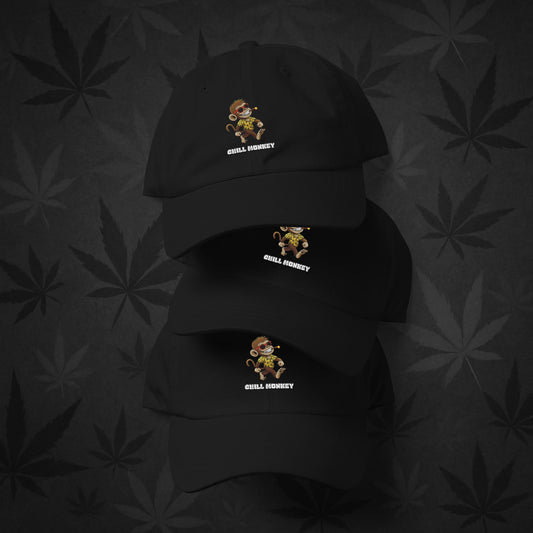 Chill Monkey dad hat with embroidered Chill Monkey mascot smoking cannabis, streetwear 420 accessory, black color front view.