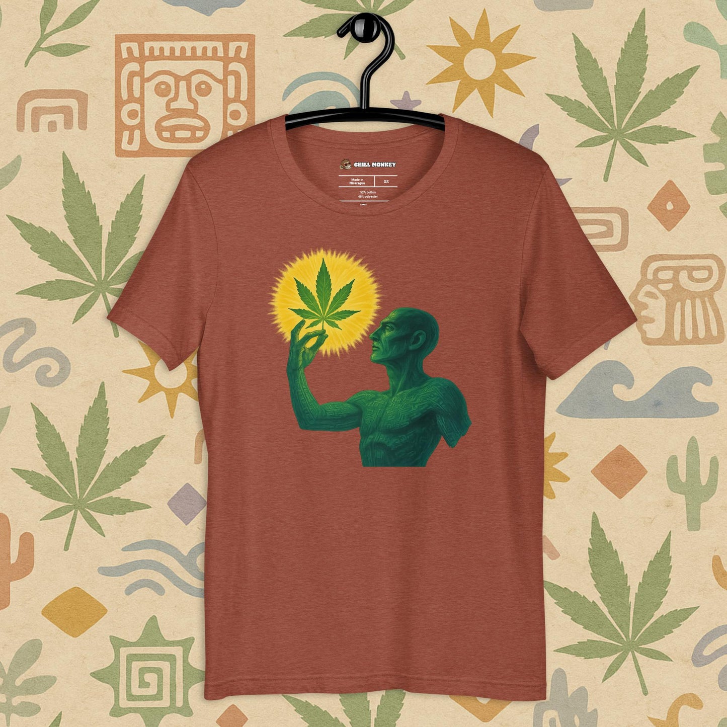 Chill Monkey unisex tee “Sacred Herb” featuring green mystical figure holding glowing cannabis leaf, streetwear 420 design, front view, clay color.