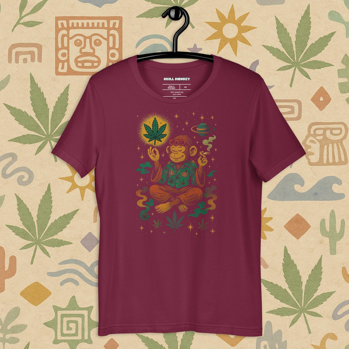 Chill Monkey unisex tee “Zen Monkey” streetwear 420 featuring meditating monkey, glowing cannabis leaf and cosmic motifs, front print view, vintage maroon color.
