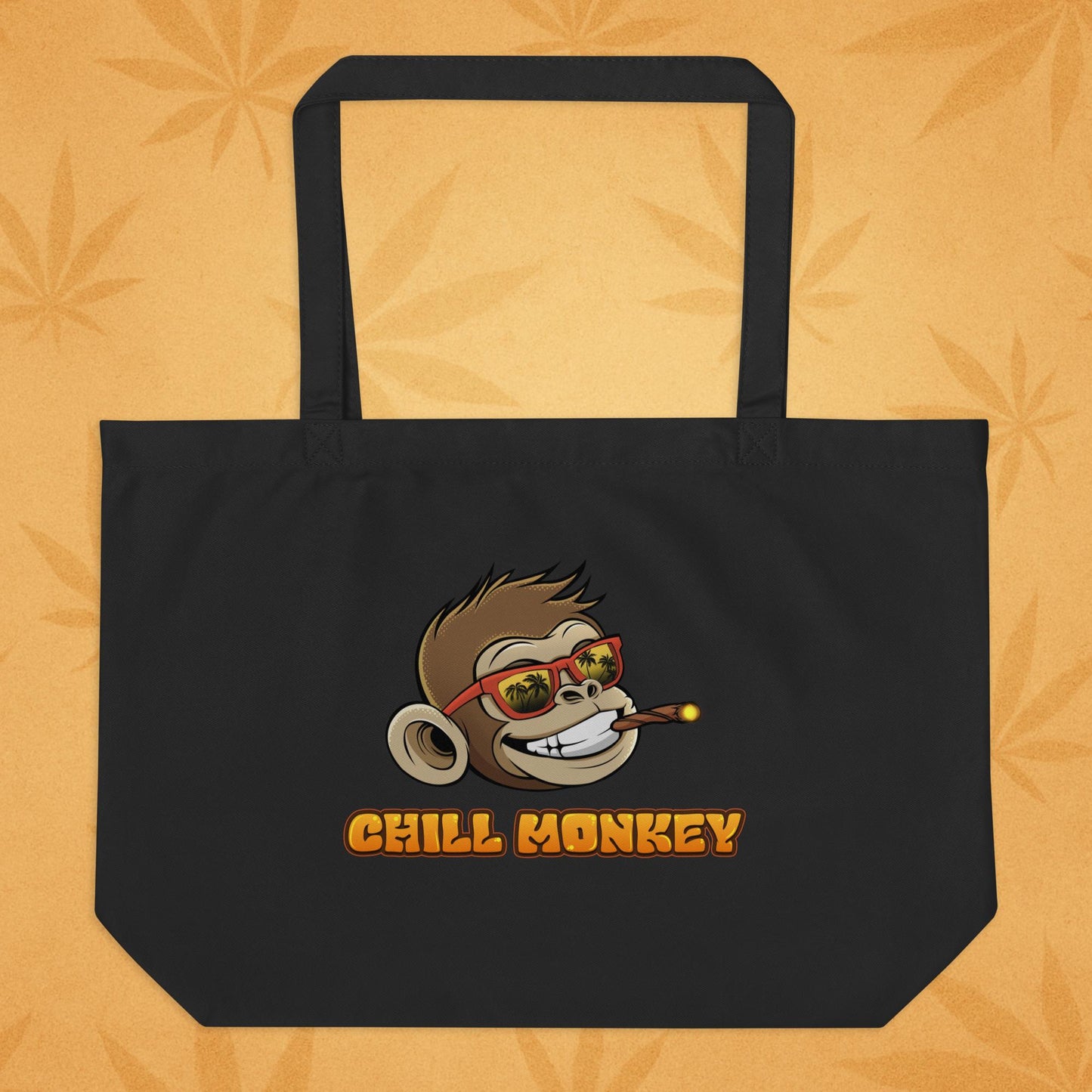 Back view of the same oyster-tone eco tote featuring the smiling Chill Monkey head in red sunglasses and the text “CHILL MONKEY,” displayed on a warm desert-leaf backdrop.
