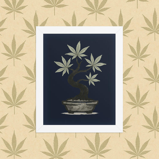 Framed 8×10 matte poster of an ink-style cannabis bonsai on a deep navy background, displayed in a simple white frame against a neutral leaf-pattern backdrop.