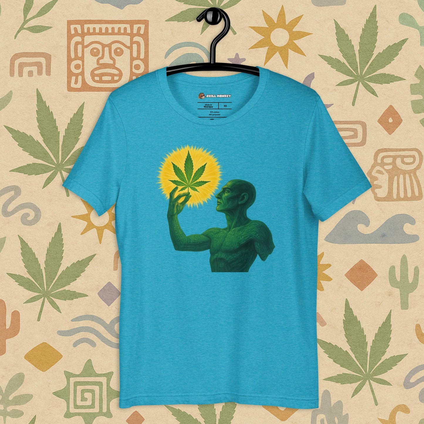 Chill Monkey unisex tee “Sacred Herb” featuring green mystical figure holding glowing cannabis leaf, streetwear 420 design, front view, aqua color.
