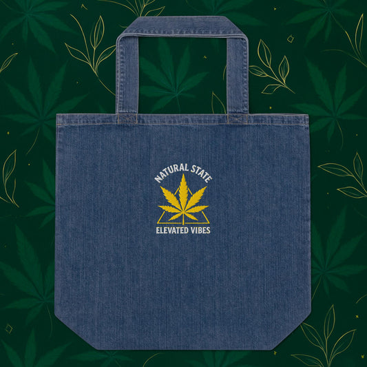 Chill Monkey organic denim tote bag “Gold Leaf” streetwear 420 with matte-gold cannabis leaf embroidery and “Natural State • Elevated Vibes” text, front view, denim blue.